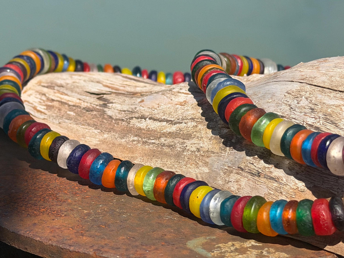 Eco friendly necklace made from recycled glass and hung in raffia. Ethical jewellery that doesnt cost the earth! Sustainable, eco gifts