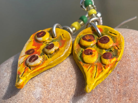 Handmade earrings using Sussex clay. Unique jewellery, ceramic earrings, boho jewellery, yellow earrings, unique earrings, yellow jewellery