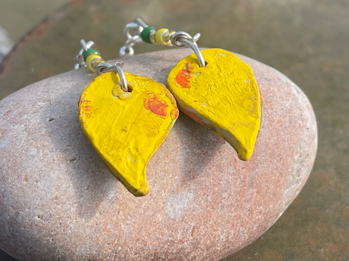 Handmade earrings using Sussex clay. Unique jewellery, ceramic earrings, boho jewellery, yellow earrings, unique earrings, yellow jewellery