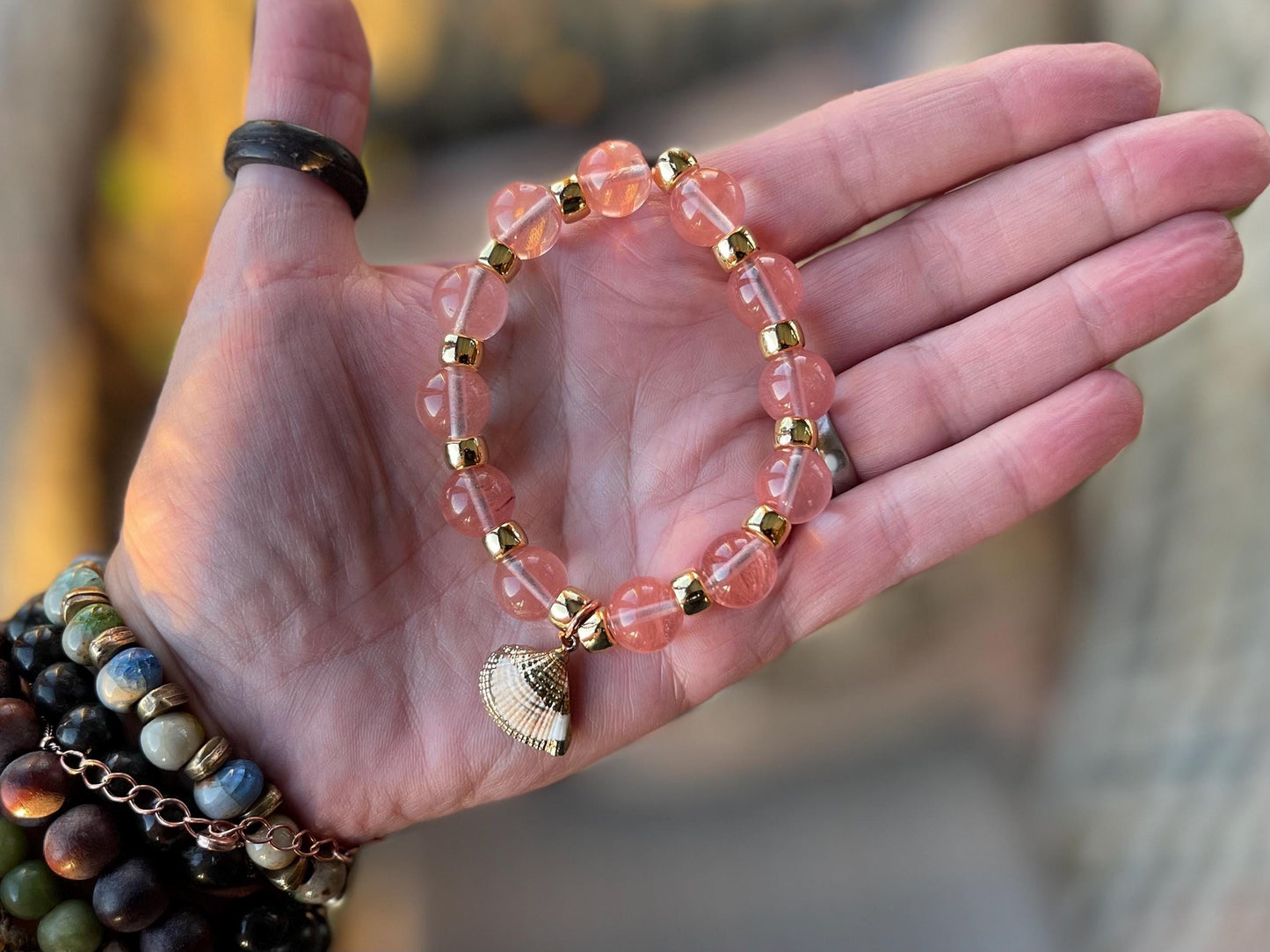 Strawberry quartz bracelet showcasing a little scallop shell. Shell jewellery, quartz bangle, ethical jewellery, handmade pink bracelet