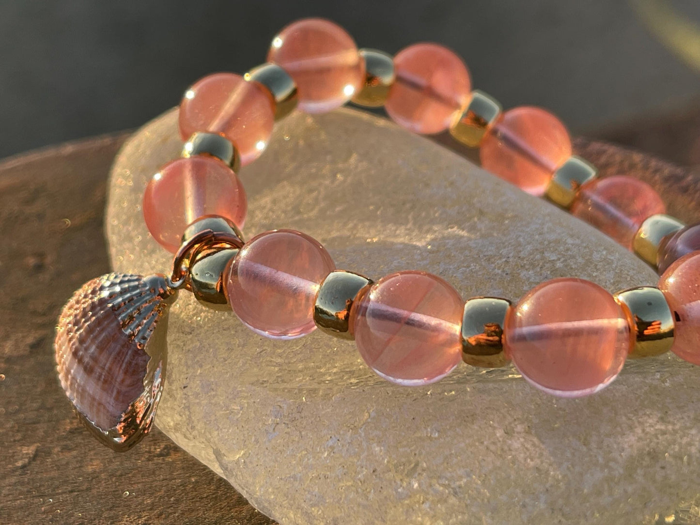 Strawberry quartz bracelet showcasing a little scallop shell. Shell jewellery, quartz bangle, ethical jewellery, handmade pink bracelet