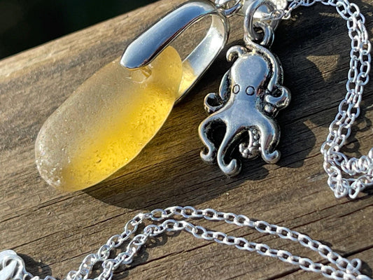 Eco friendly sea glass necklace on a sterling silver chain showcasing a little octopus. Octopus pendant, octopus necklace, ethical jewellery