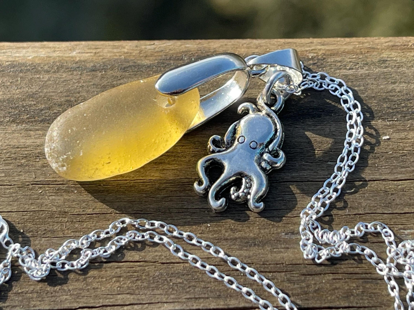 Eco friendly sea glass necklace on a sterling silver chain showcasing a little octopus. Octopus pendant, octopus necklace, ethical jewellery