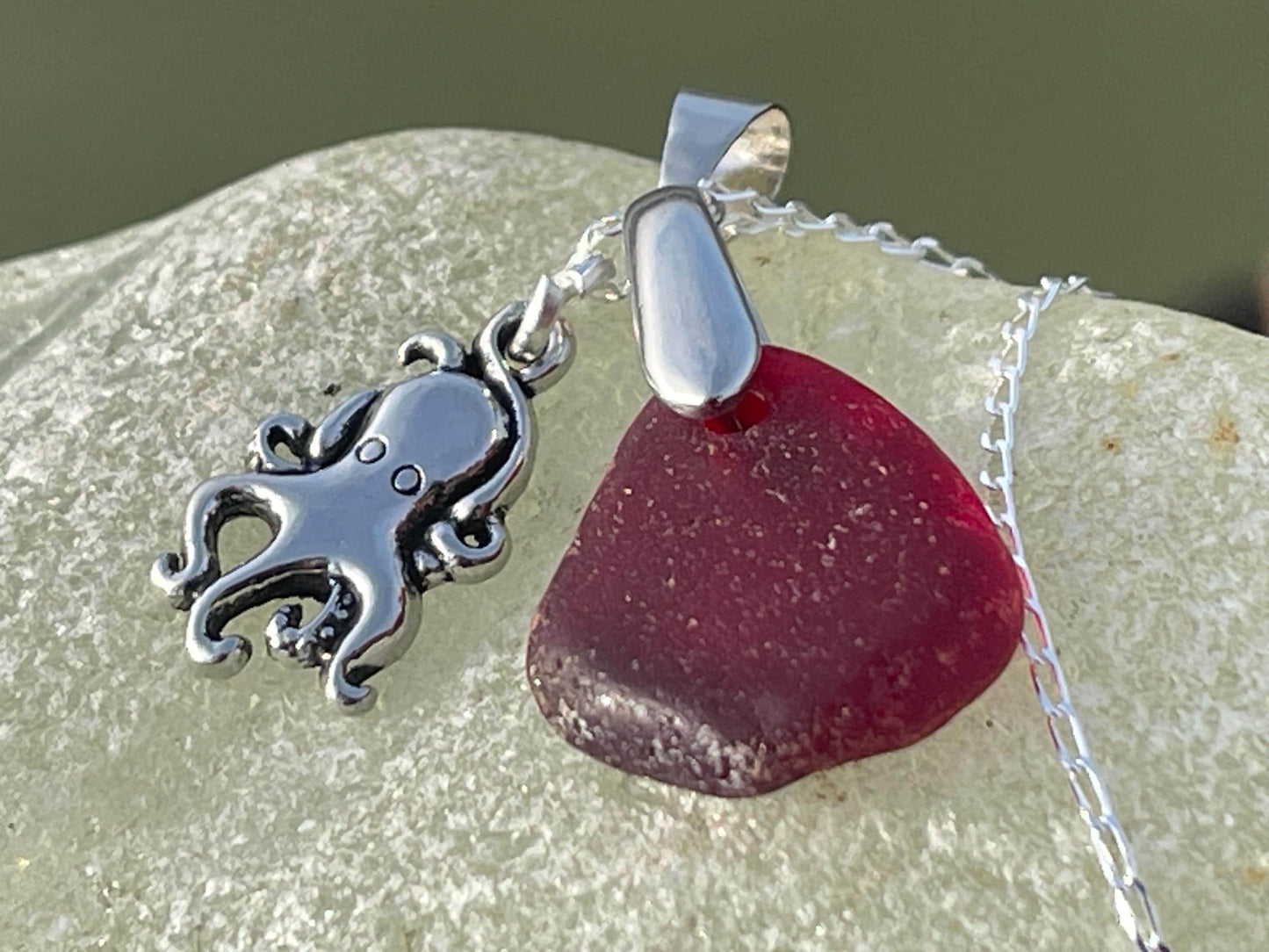 Eco friendly sea glass necklace on a sterling silver chain showcasing a little octopus. Octopus pendant, octopus necklace, ethical jewellery