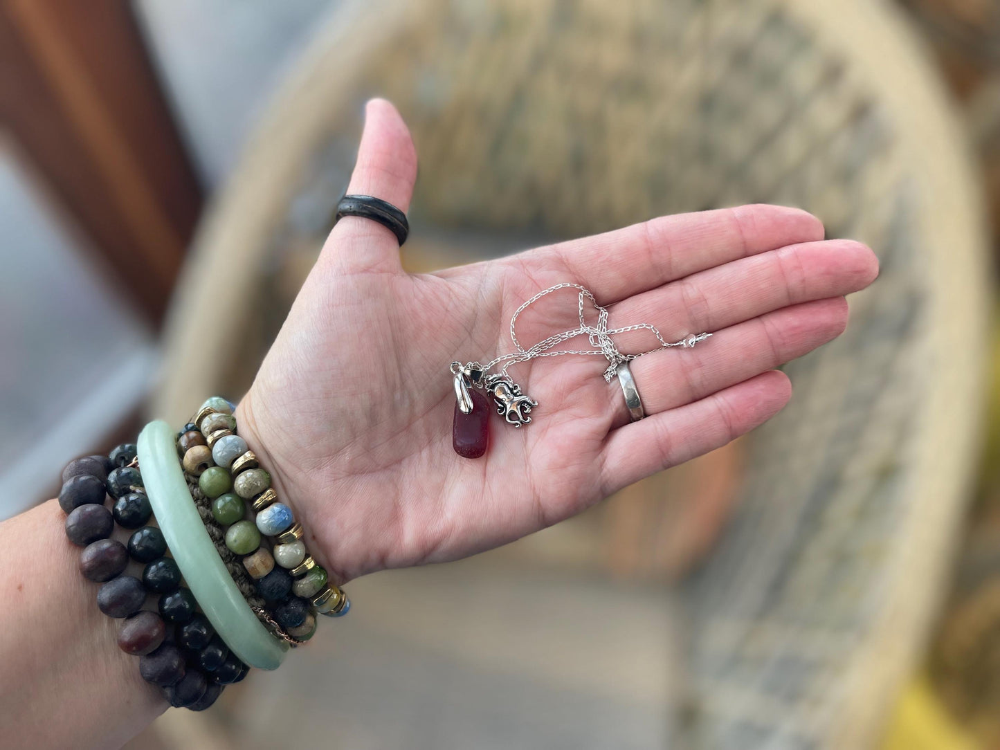 Eco friendly sea glass necklace on a sterling silver chain showcasing a little octopus. Octopus pendant, octopus necklace, ethical jewellery