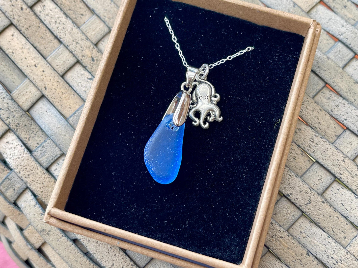 Eco friendly sea glass necklace on a sterling silver chain showcasing a little octopus. Octopus pendant, octopus necklace, ethical jewellery