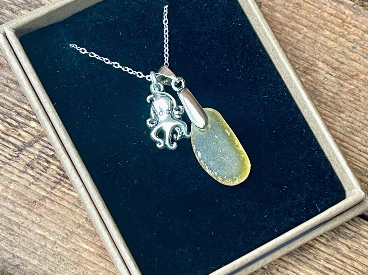 Eco friendly sea glass necklace on a sterling silver chain showcasing a little octopus. Octopus pendant, octopus necklace, ethical jewellery