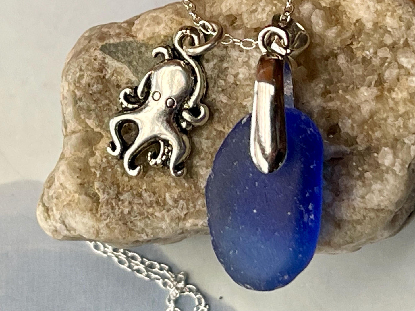 Eco friendly sea glass necklace on a sterling silver chain showcasing a little octopus. Octopus pendant, octopus necklace, ethical jewellery