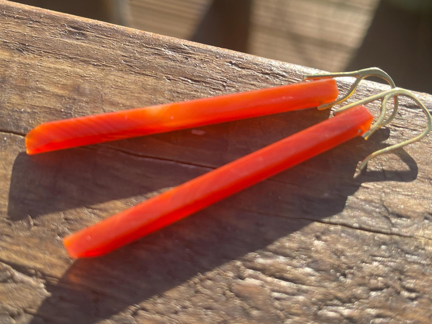 Long red agate gemstone earrings. Orange statement earrings. Long orange earrings. Unique jewellery. Ethical handmade jewellery.