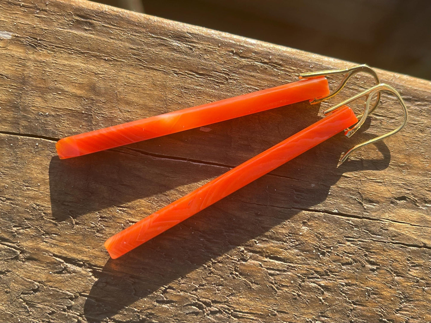 Long red agate gemstone earrings. Orange statement earrings. Long orange earrings. Unique jewellery. Ethical handmade jewellery.