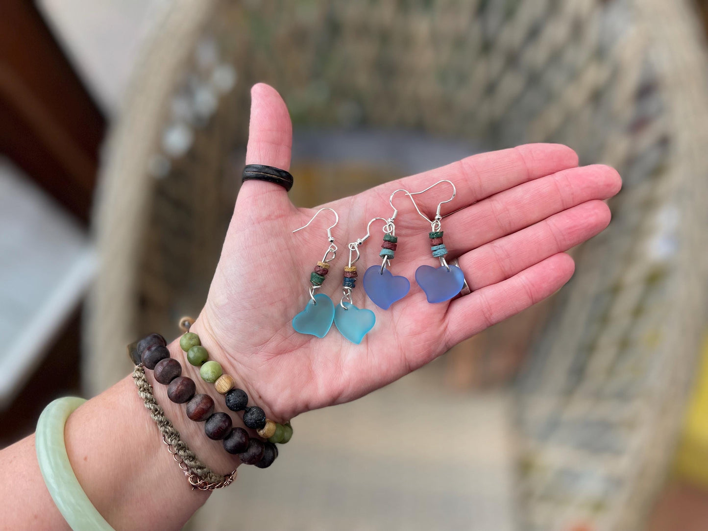 Sea glass heart earrings iron recycled sterling silver. Eco conscious jewellery. Ethical jewellery. Blue sea glass hearts. Handmade earrings