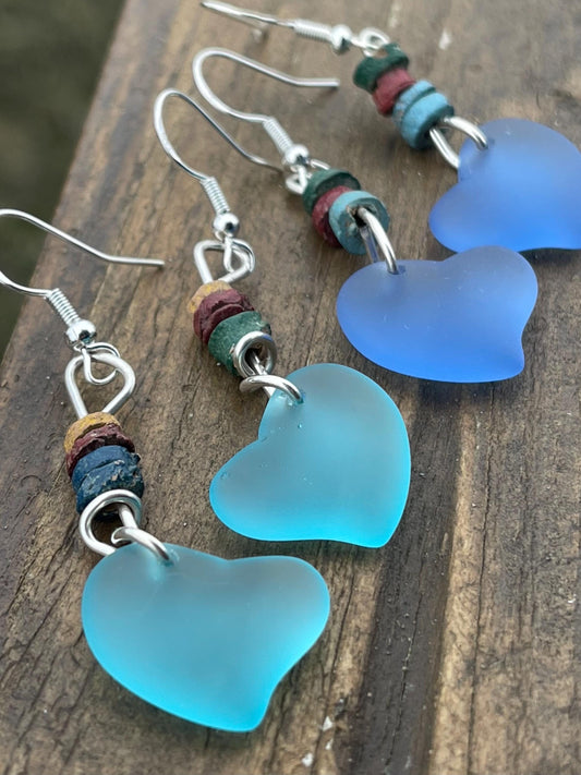 Sea glass heart earrings iron recycled sterling silver. Eco conscious jewellery. Ethical jewellery. Blue sea glass hearts. Handmade earrings