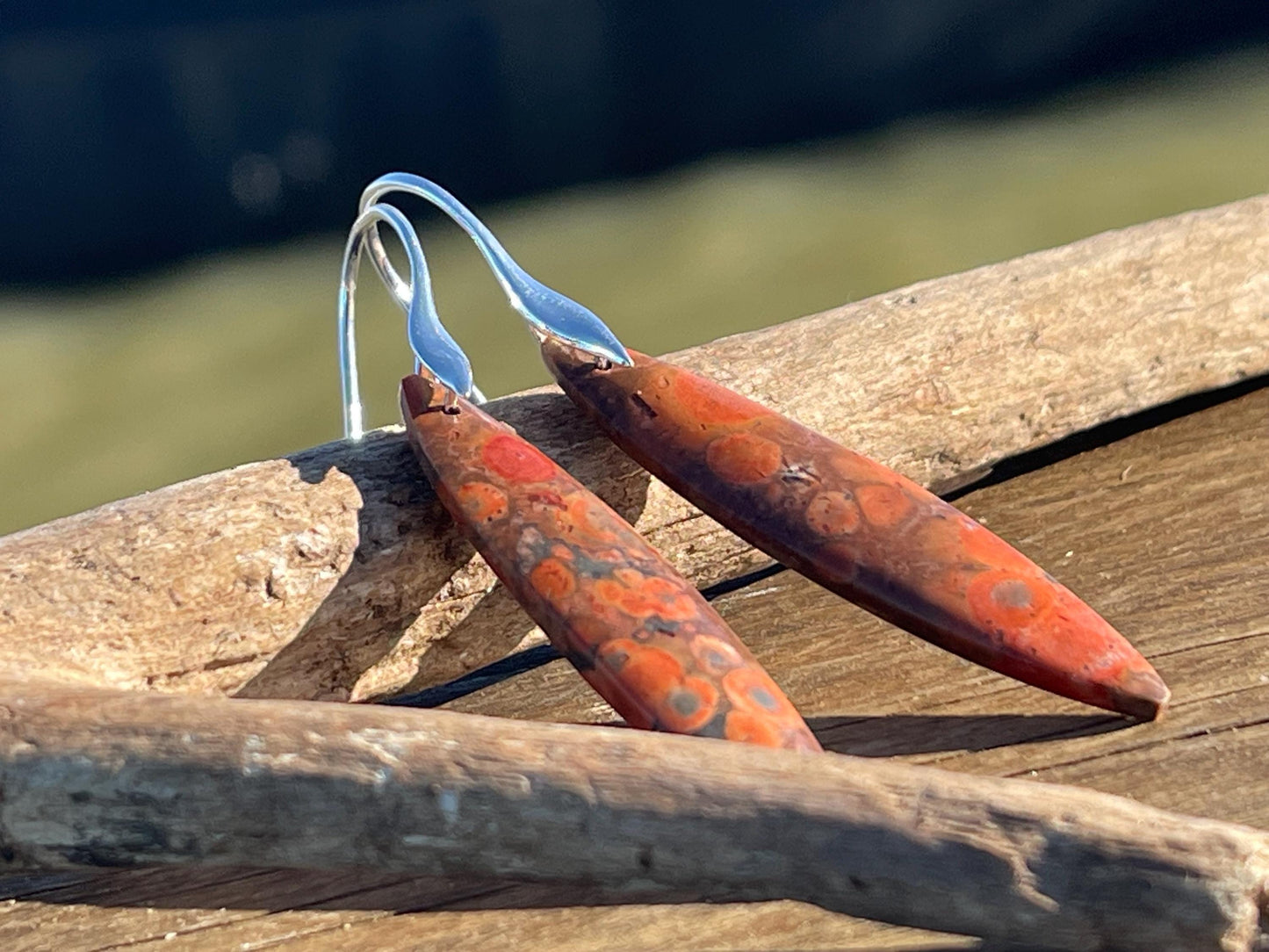 Orange rhyolite gemstone earrings. Long drop dangly earrings. Orange gemstone earrings. Ethical jewellery, orange jewellery. Handmade.