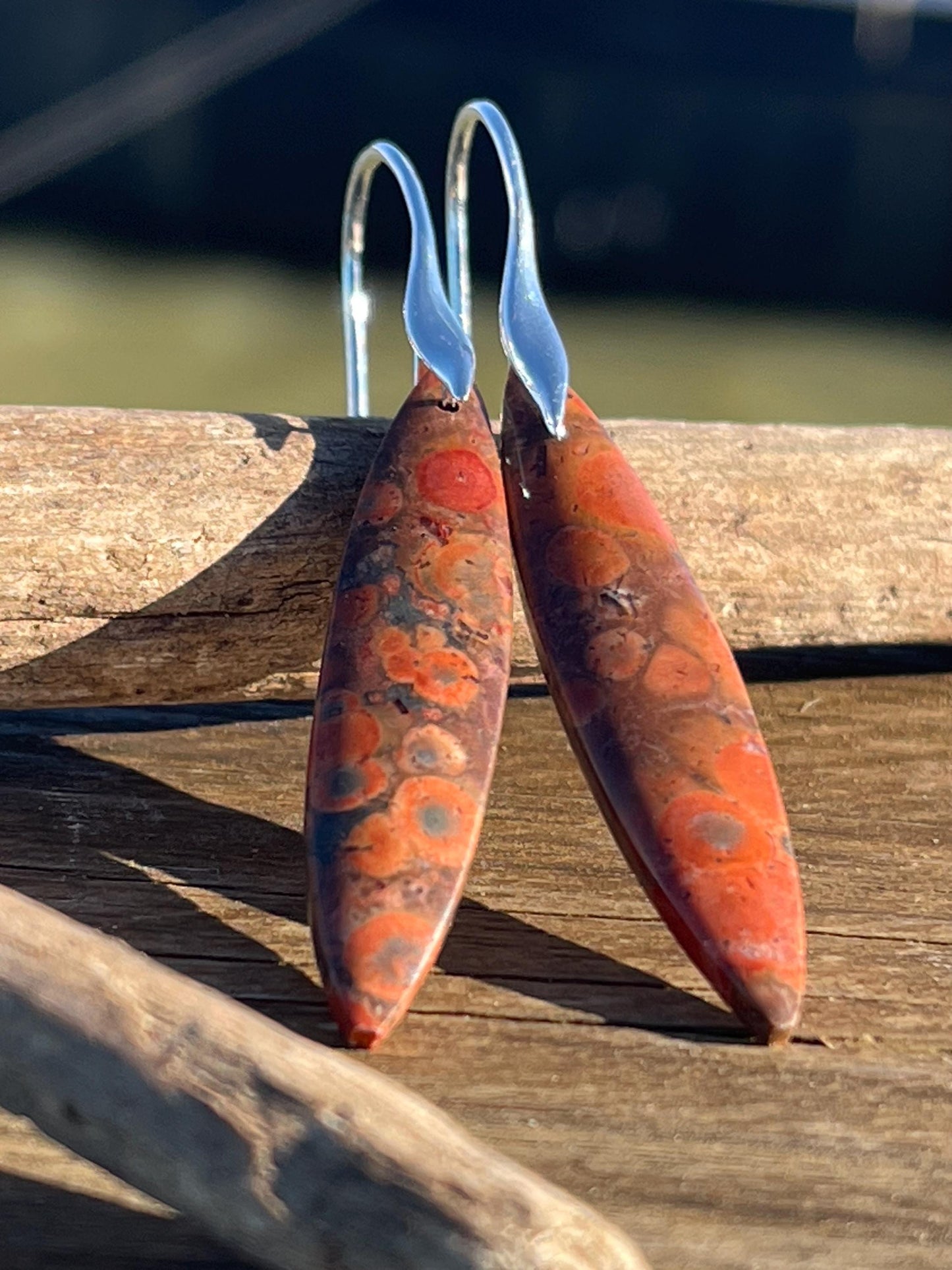 Orange rhyolite gemstone earrings. Long drop dangly earrings. Orange gemstone earrings. Ethical jewellery, orange jewellery. Handmade.