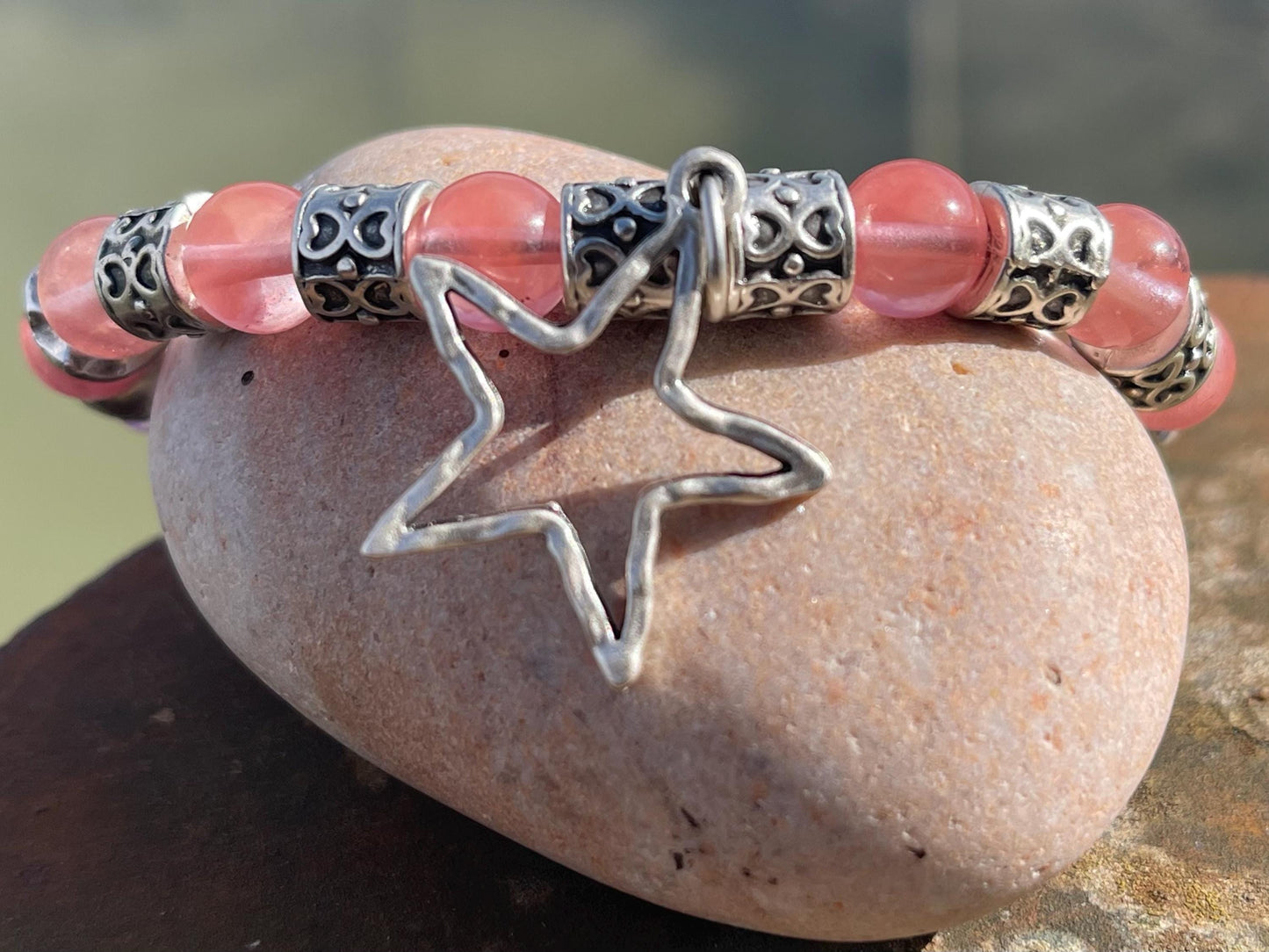 Strawberry quartz bracelet showcasing a silver star. Star jewellery, ethical jewellery, handmade pink bracelet. Congratulations gift.