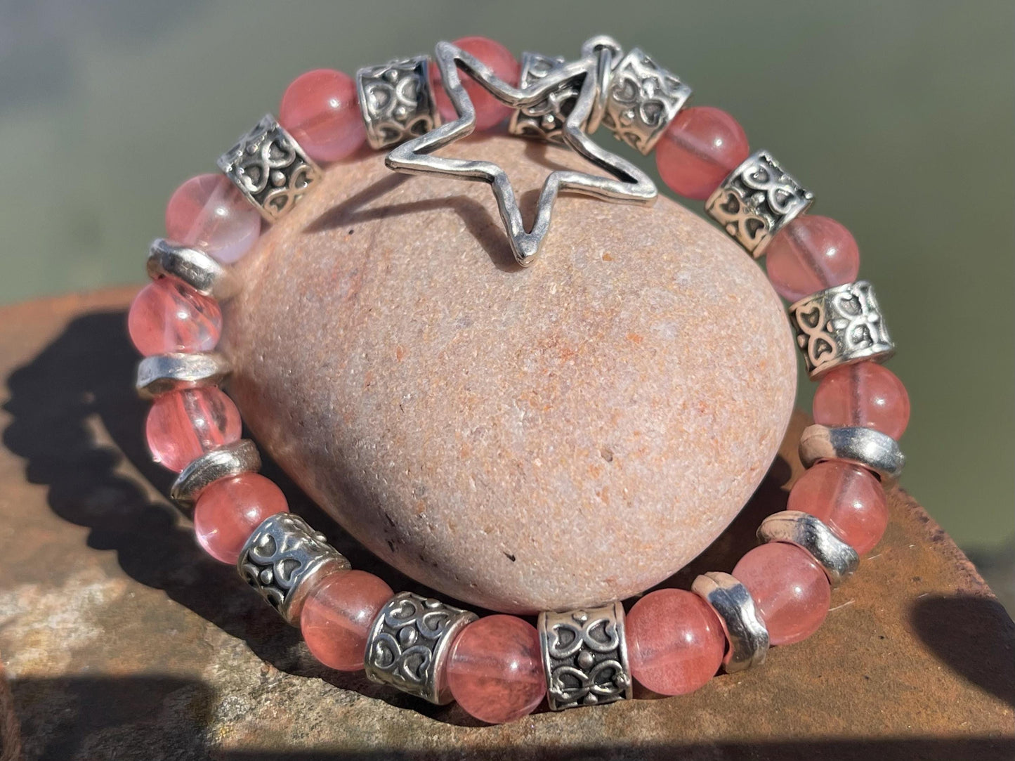 Strawberry quartz bracelet showcasing a silver star. Star jewellery, ethical jewellery, handmade pink bracelet. Congratulations gift.