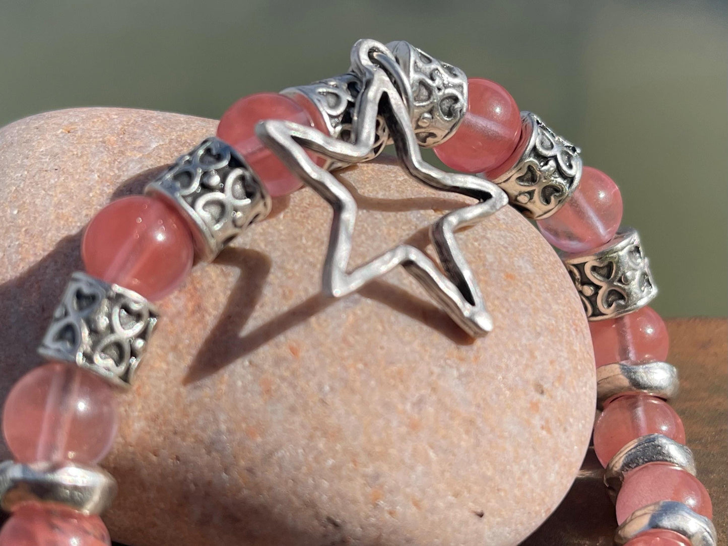 Strawberry quartz bracelet showcasing a silver star. Star jewellery, ethical jewellery, handmade pink bracelet. Congratulations gift.