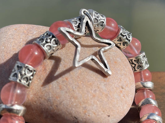 Strawberry quartz bracelet showcasing a silver star. Star jewellery, ethical jewellery, handmade pink bracelet. Congratulations gift.