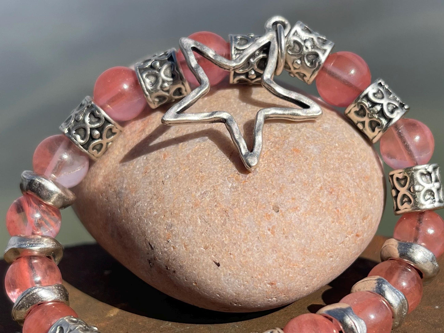 Strawberry quartz bracelet showcasing a silver star. Star jewellery, ethical jewellery, handmade pink bracelet. Congratulations gift.