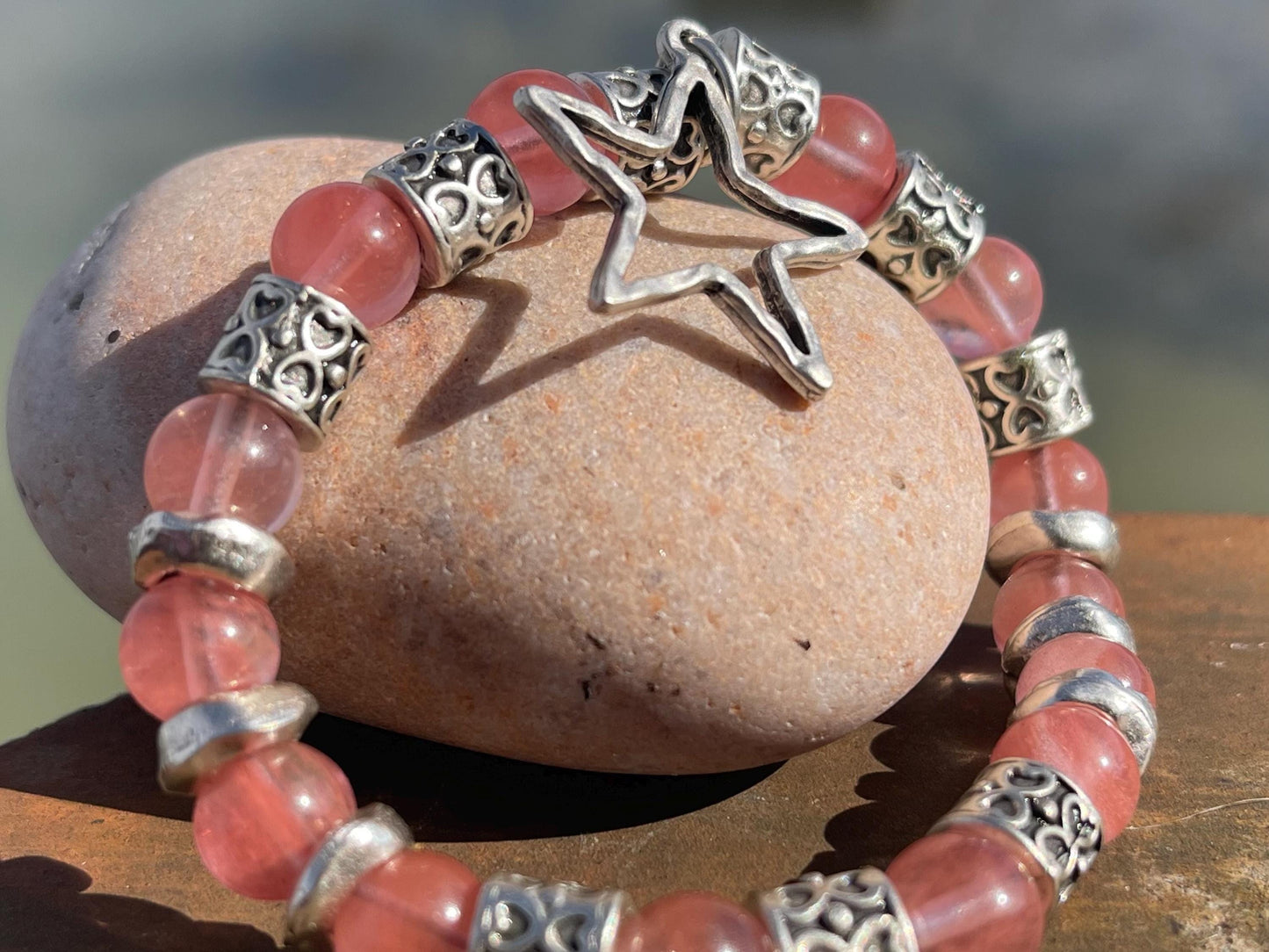 Strawberry quartz bracelet showcasing a silver star. Star jewellery, ethical jewellery, handmade pink bracelet. Congratulations gift.