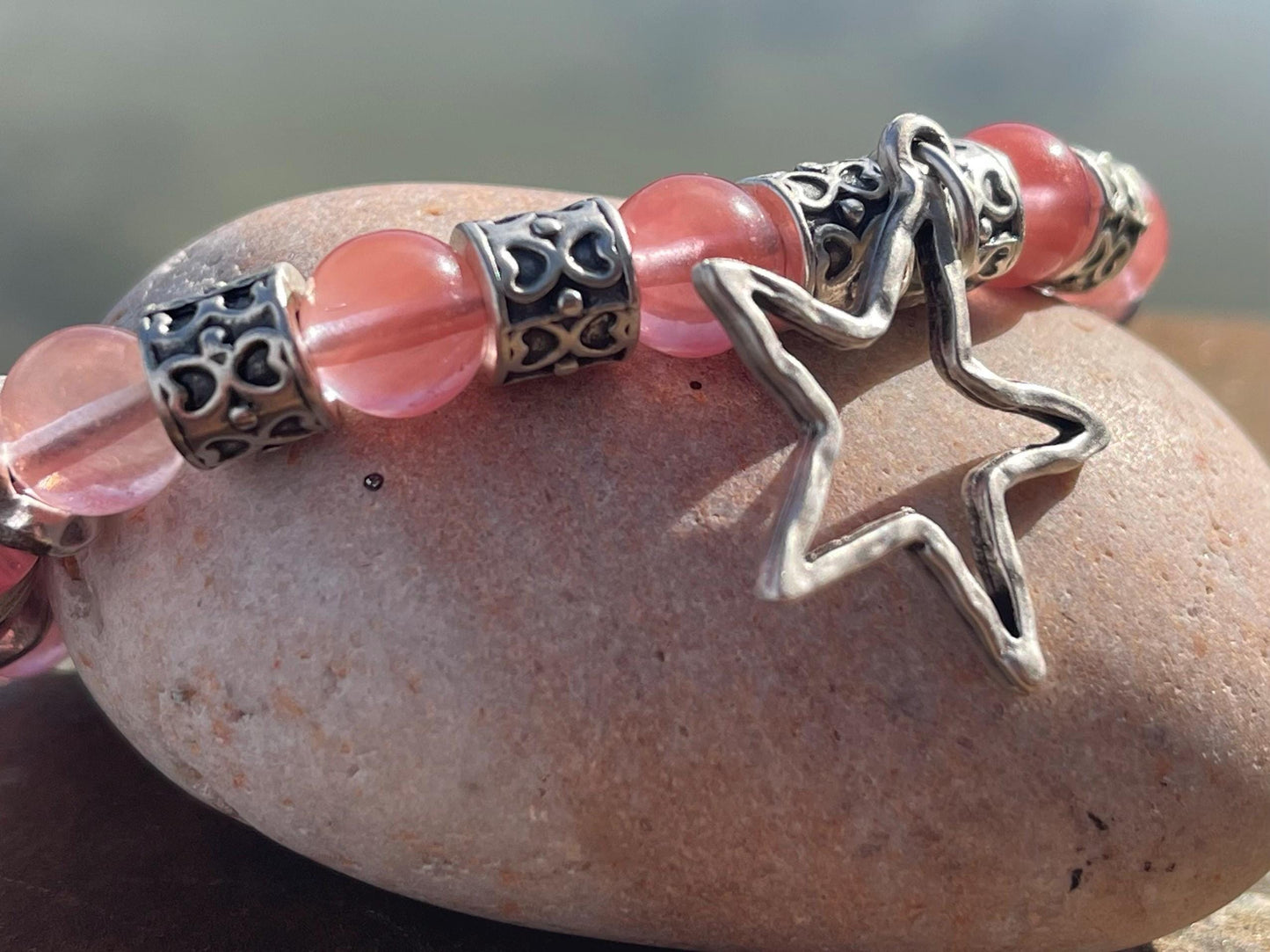 Strawberry quartz bracelet showcasing a silver star. Star jewellery, ethical jewellery, handmade pink bracelet. Congratulations gift.