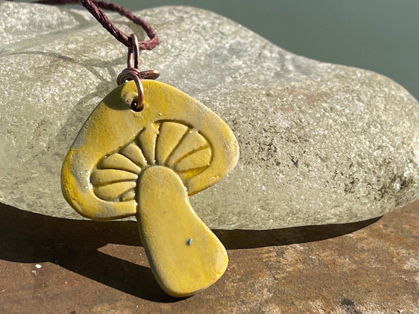 Handmade mushroom necklaces. Eco friendly jewellery. Ethical pendants made with waste clay and burnt recycled copper. Ethical jewellery.