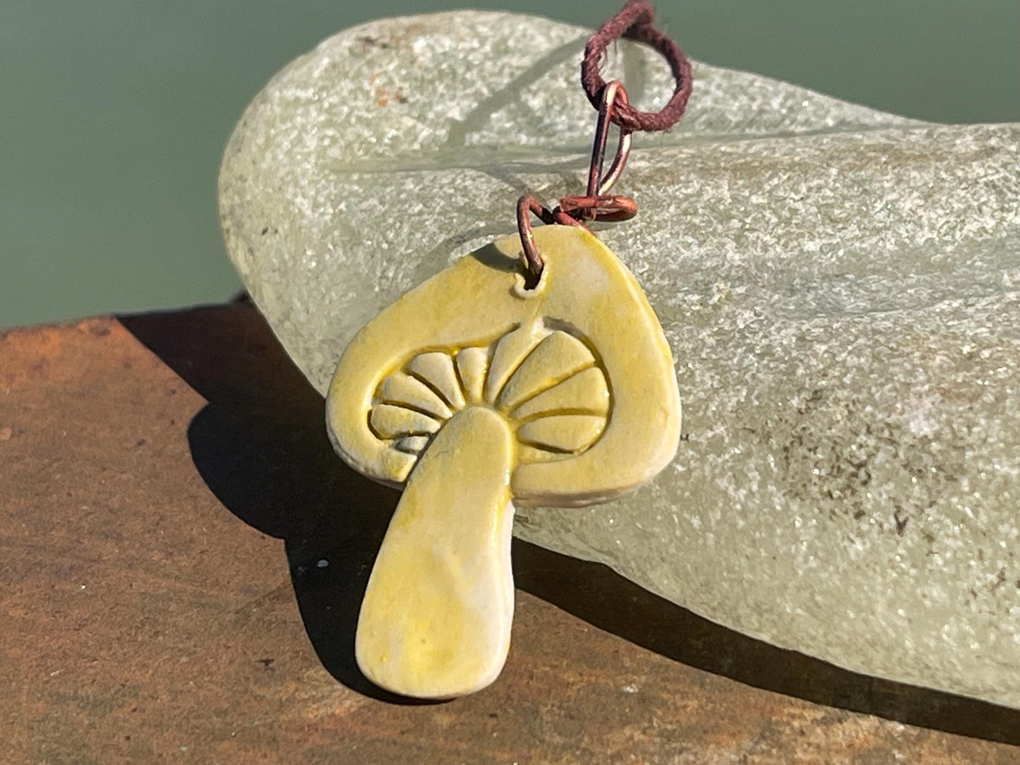 Handmade mushroom necklaces. Eco friendly jewellery. Ethical pendants made with waste clay and burnt recycled copper. Ethical jewellery.