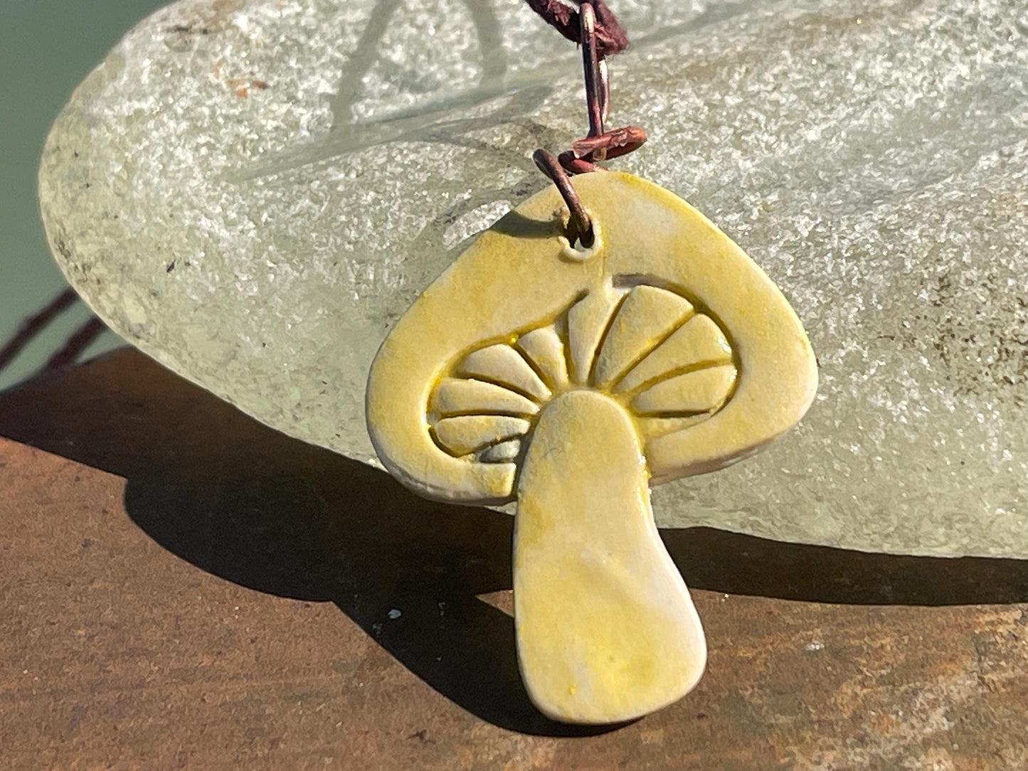 Handmade mushroom necklaces. Eco friendly jewellery. Ethical pendants made with waste clay and burnt recycled copper. Ethical jewellery.