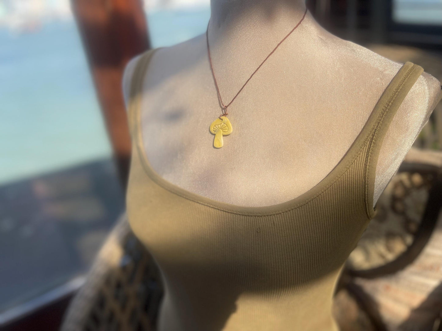 Handmade mushroom necklaces. Eco friendly jewellery. Ethical pendants made with waste clay and burnt recycled copper. Ethical jewellery.