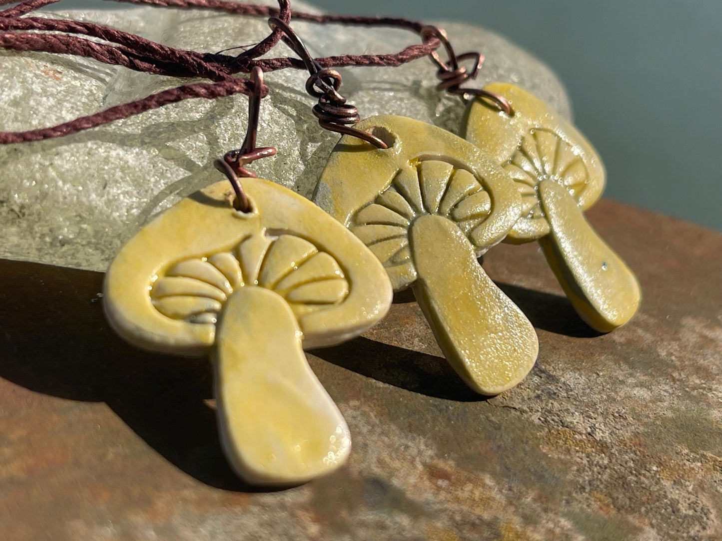 Handmade mushroom necklaces. Eco friendly jewellery. Ethical pendants made with waste clay and burnt recycled copper. Ethical jewellery.