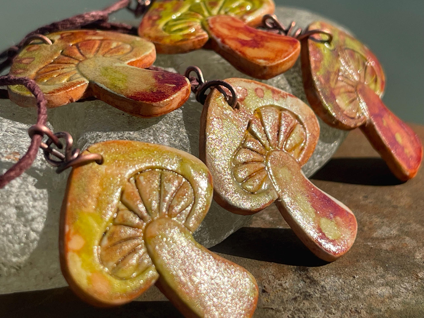 Handmade mushroom necklaces. Eco friendly jewellery. Ethical pendants made with waste clay and burnt recycled copper. Ethical jewellery.