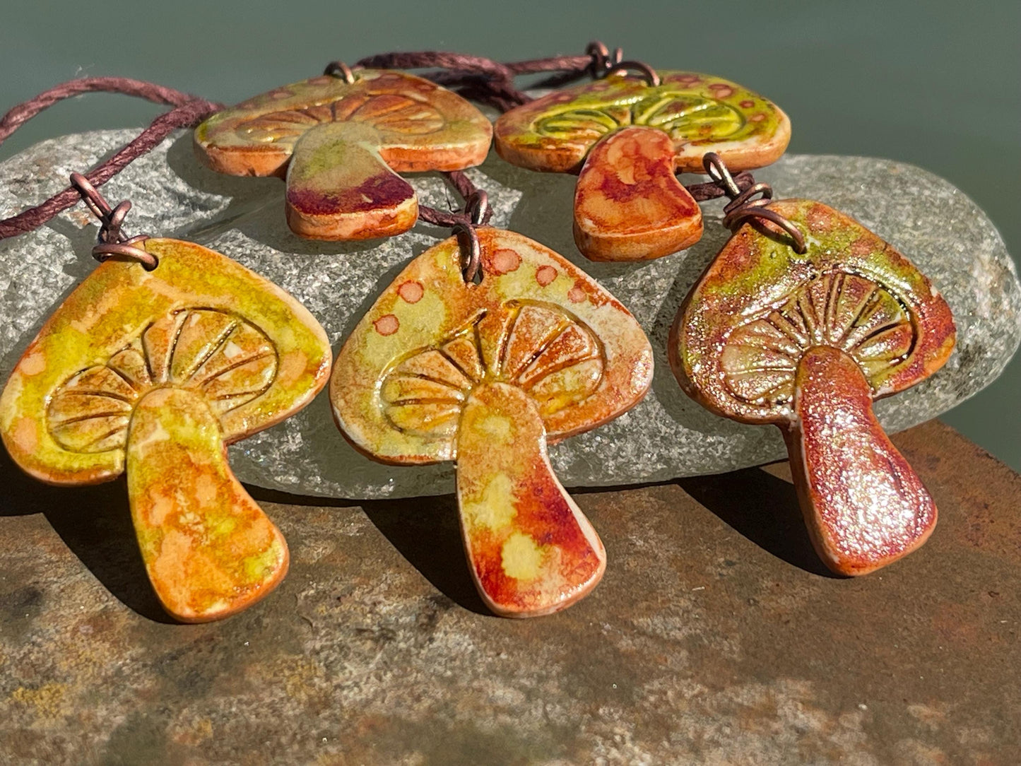 Handmade mushroom necklaces. Eco friendly jewellery. Ethical pendants made with waste clay and burnt recycled copper. Ethical jewellery.