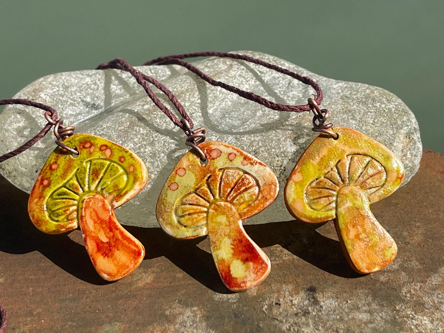 Handmade mushroom necklaces. Eco friendly jewellery. Ethical pendants made with waste clay and burnt recycled copper. Ethical jewellery.
