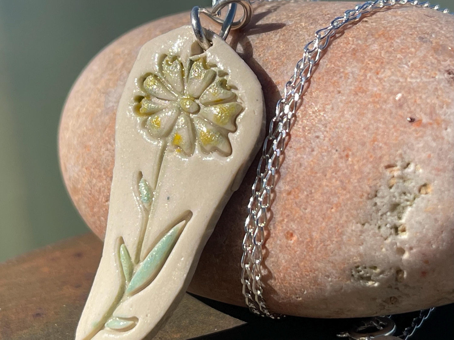 Handmade daisy necklace. Eco friendly jewellery. Ethical pendants made with waste clay and recycled sterling silver. Ethical jewellery.