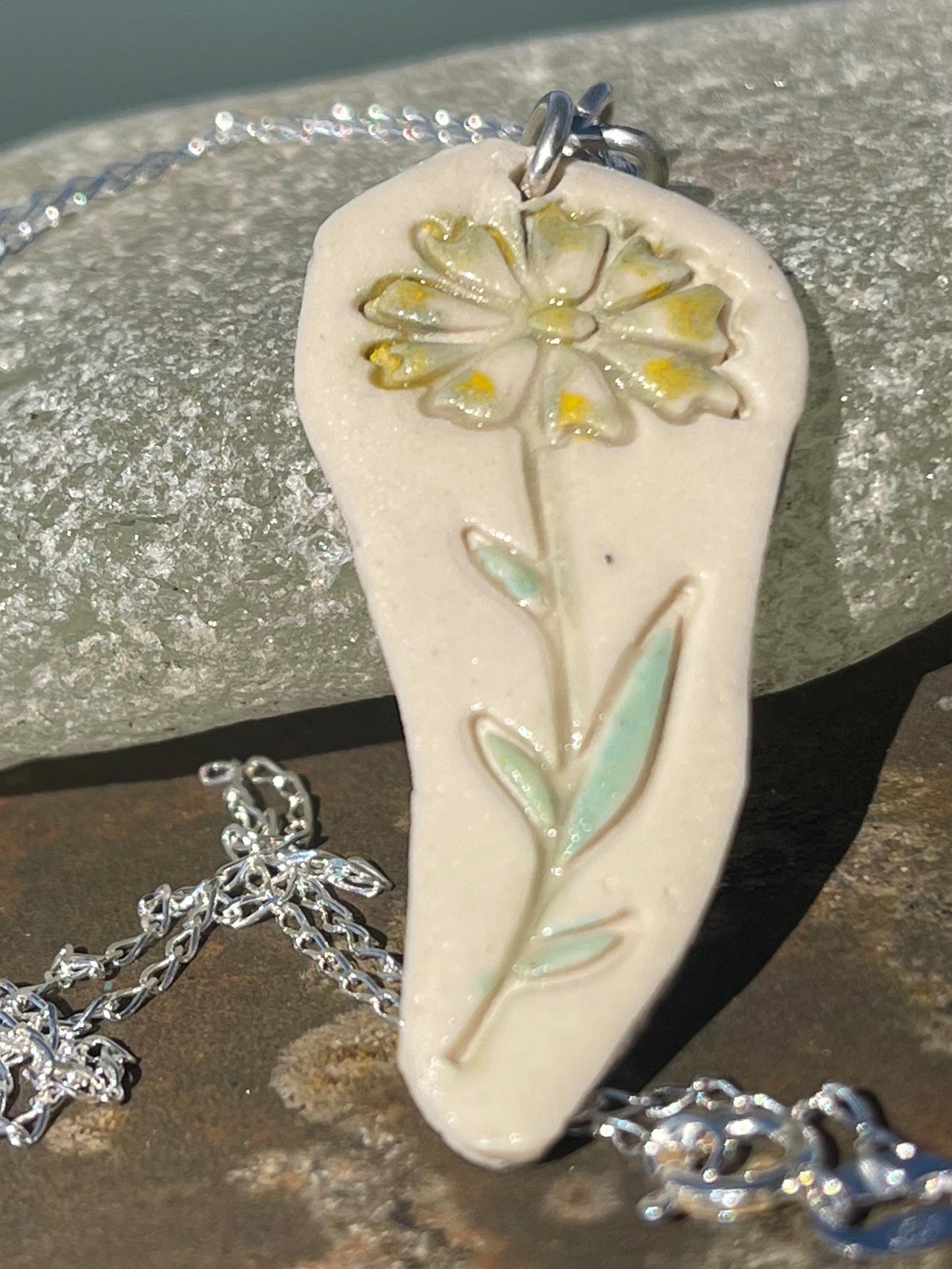 Handmade daisy necklace. Eco friendly jewellery. Ethical pendants made with waste clay and recycled sterling silver. Ethical jewellery.