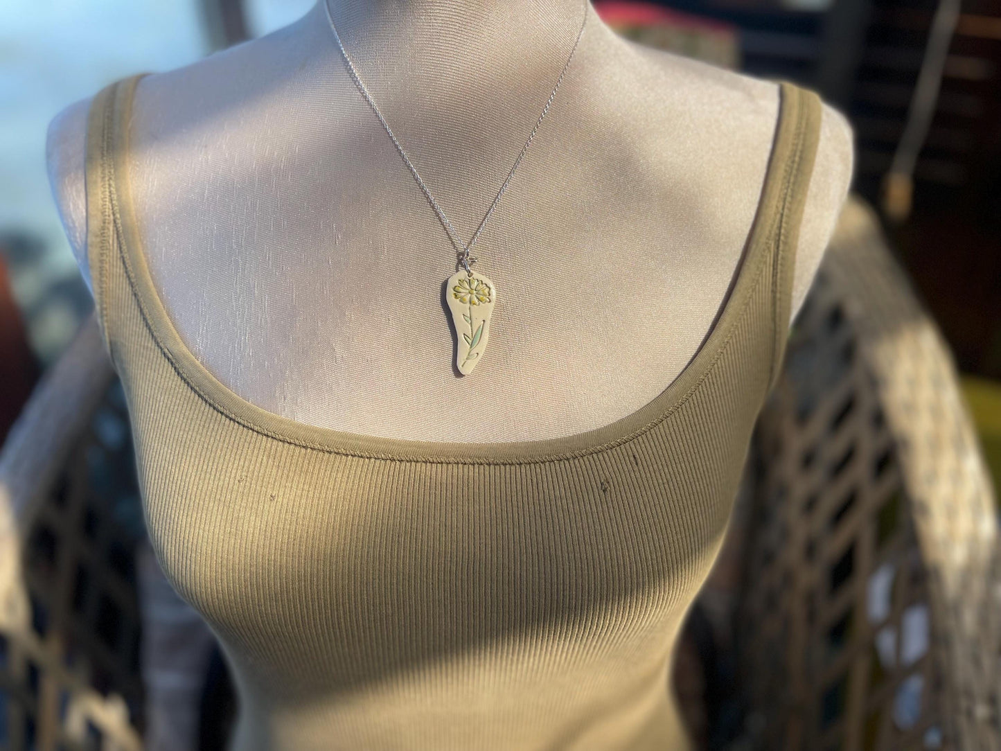Handmade daisy necklace. Eco friendly jewellery. Ethical pendants made with waste clay and recycled sterling silver. Ethical jewellery.