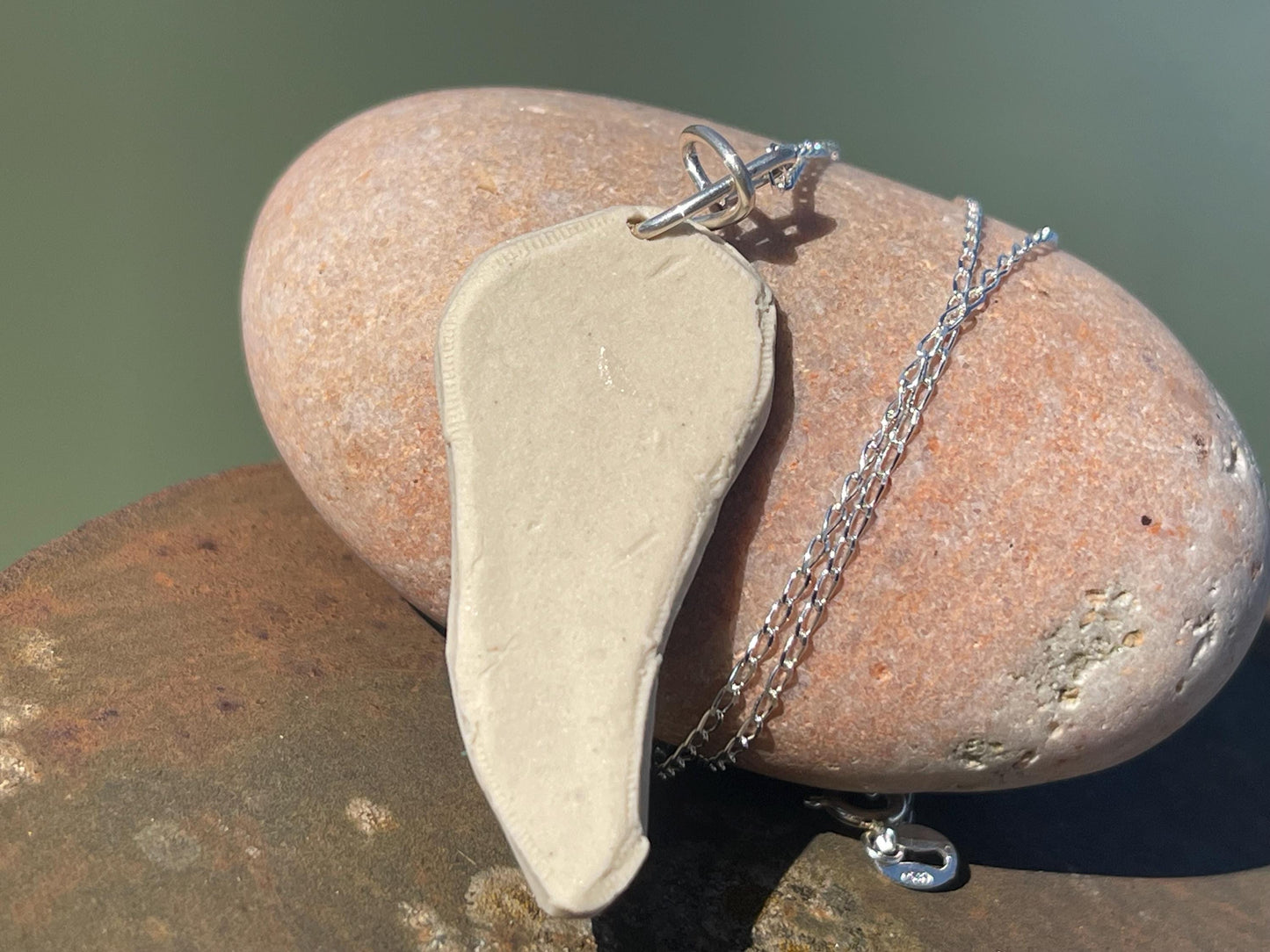 Handmade daisy necklace. Eco friendly jewellery. Ethical pendants made with waste clay and recycled sterling silver. Ethical jewellery.