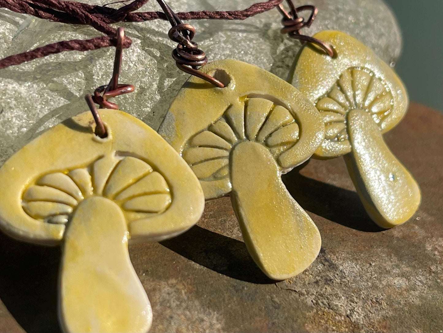 Handmade mushroom necklaces. Eco friendly jewellery. Ethical pendants made with waste clay and burnt recycled copper. Ethical jewellery.