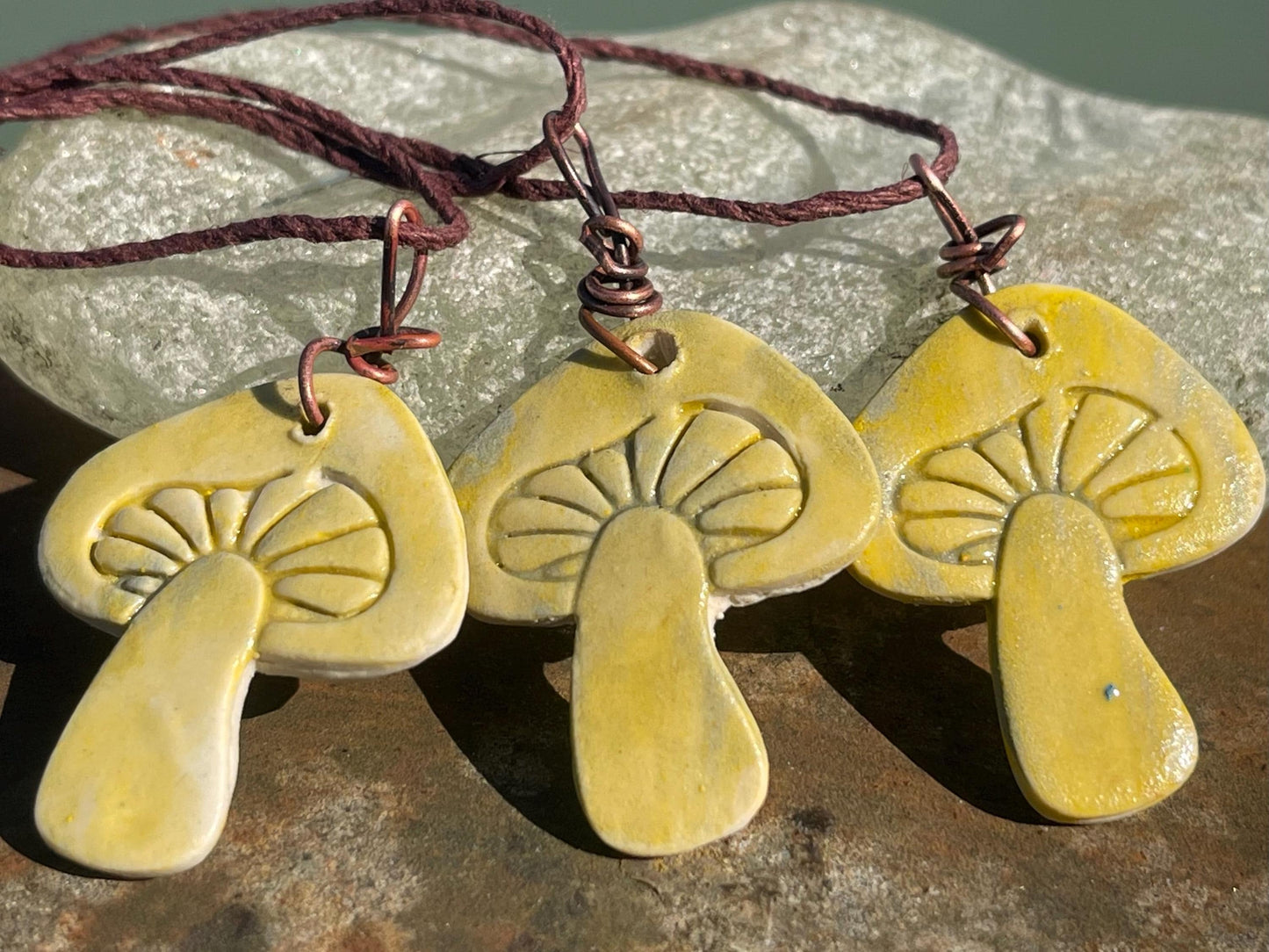 Handmade mushroom necklaces. Eco friendly jewellery. Ethical pendants made with waste clay and burnt recycled copper. Ethical jewellery.