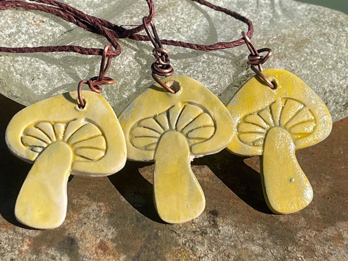 Handmade mushroom necklaces. Eco friendly jewellery. Ethical pendants made with waste clay and burnt recycled copper. Ethical jewellery.