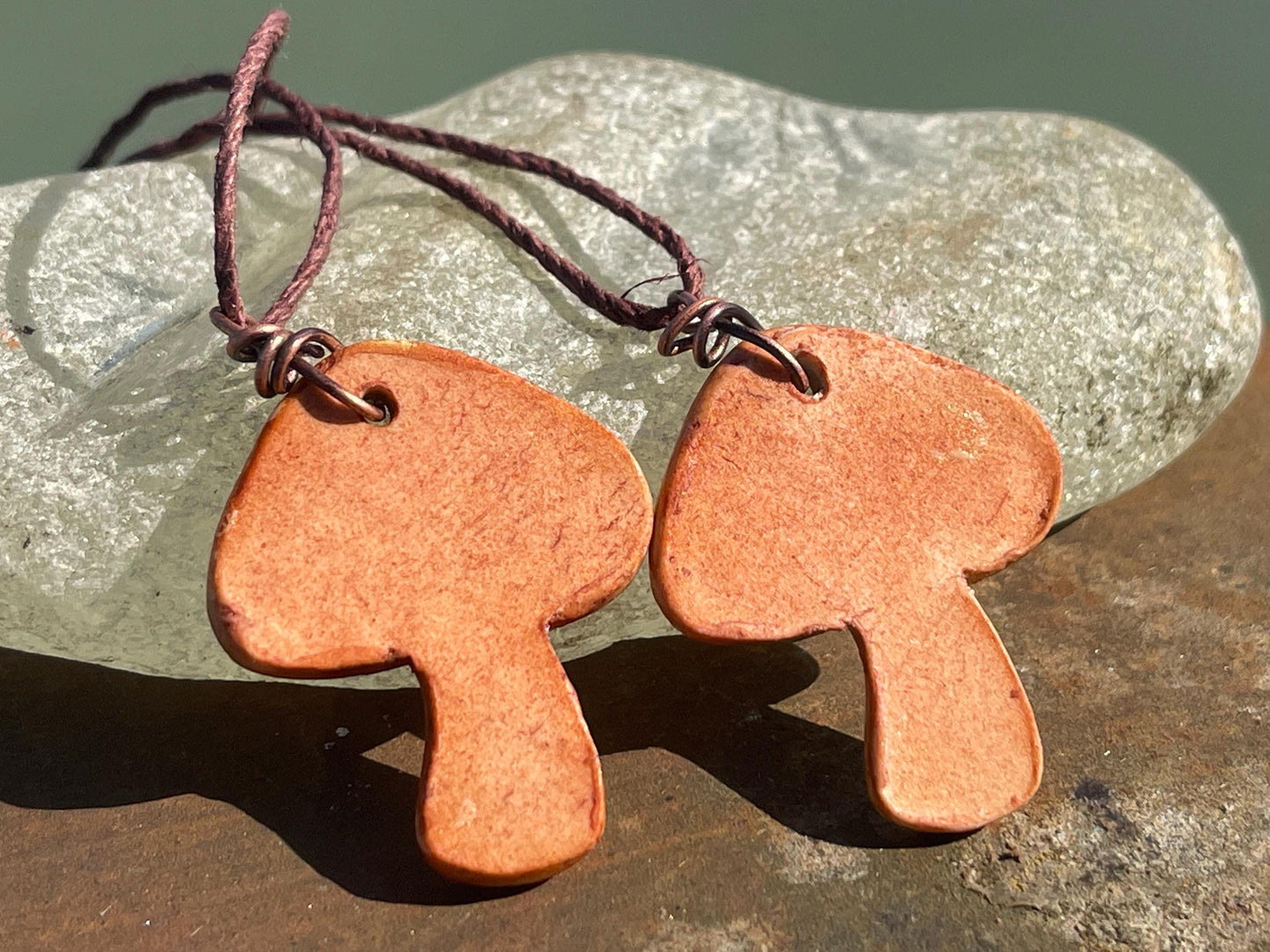 Handmade mushroom necklaces. Eco friendly jewellery. Ethical pendants made with waste clay and burnt recycled copper. Ethical jewellery.