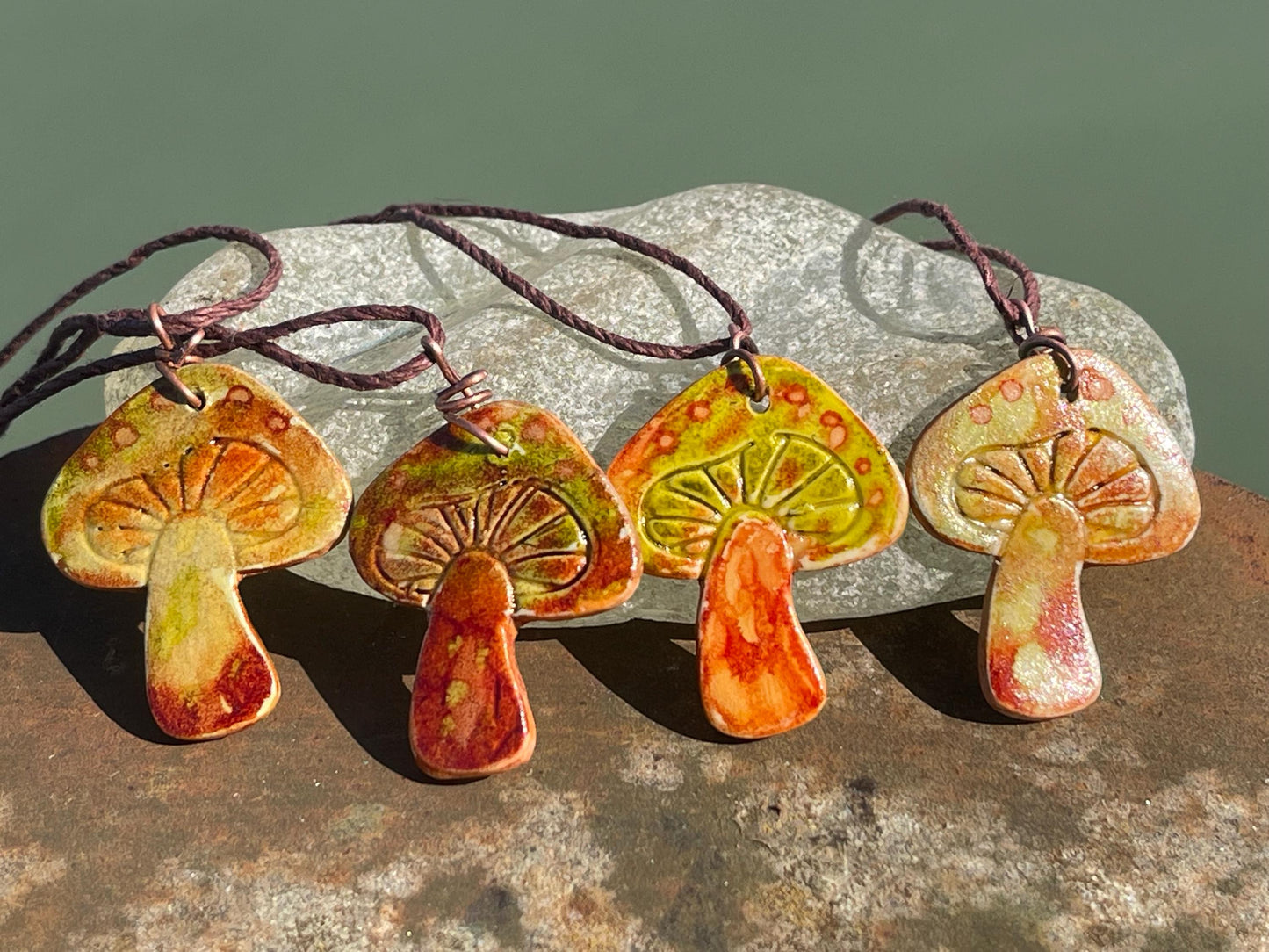 Handmade mushroom necklaces. Eco friendly jewellery. Ethical pendants made with waste clay and burnt recycled copper. Ethical jewellery.