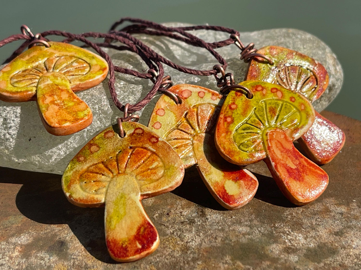 Handmade mushroom necklaces. Eco friendly jewellery. Ethical pendants made with waste clay and burnt recycled copper. Ethical jewellery.