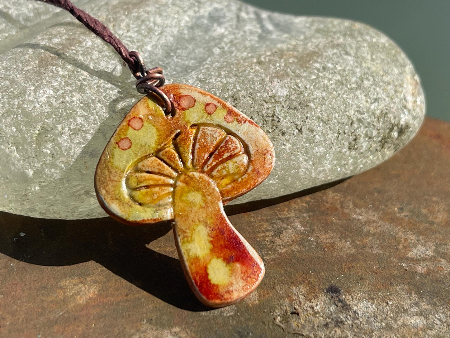 Handmade mushroom necklaces. Eco friendly jewellery. Ethical pendants made with waste clay and burnt recycled copper. Ethical jewellery.