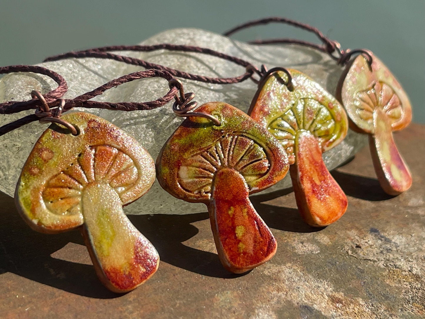 Handmade mushroom necklaces. Eco friendly jewellery. Ethical pendants made with waste clay and burnt recycled copper. Ethical jewellery.