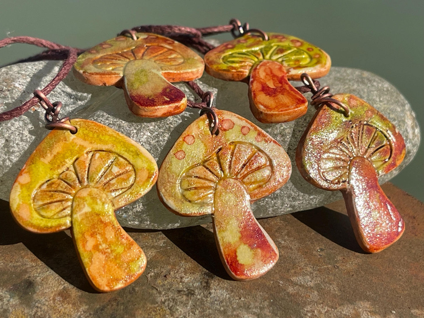 Handmade mushroom necklaces. Eco friendly jewellery. Ethical pendants made with waste clay and burnt recycled copper. Ethical jewellery.