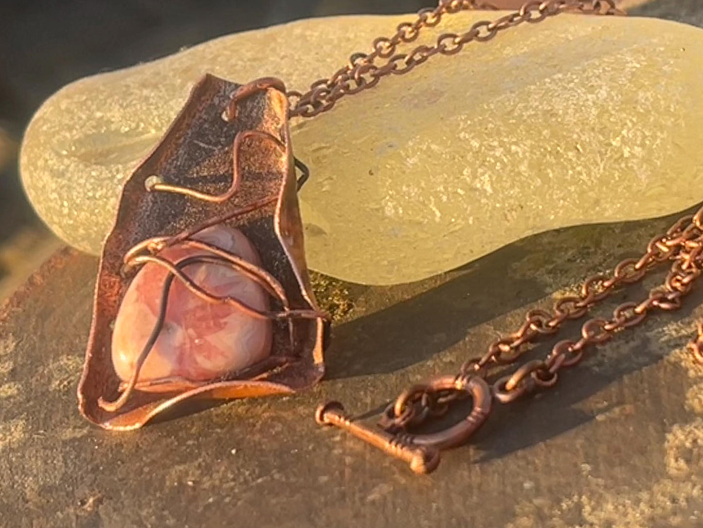 Eco friendly handmade necklace made from Rhodochrosite & naturally weathered recycled copper. Ethical jewellery. Unique handmade jewellery.