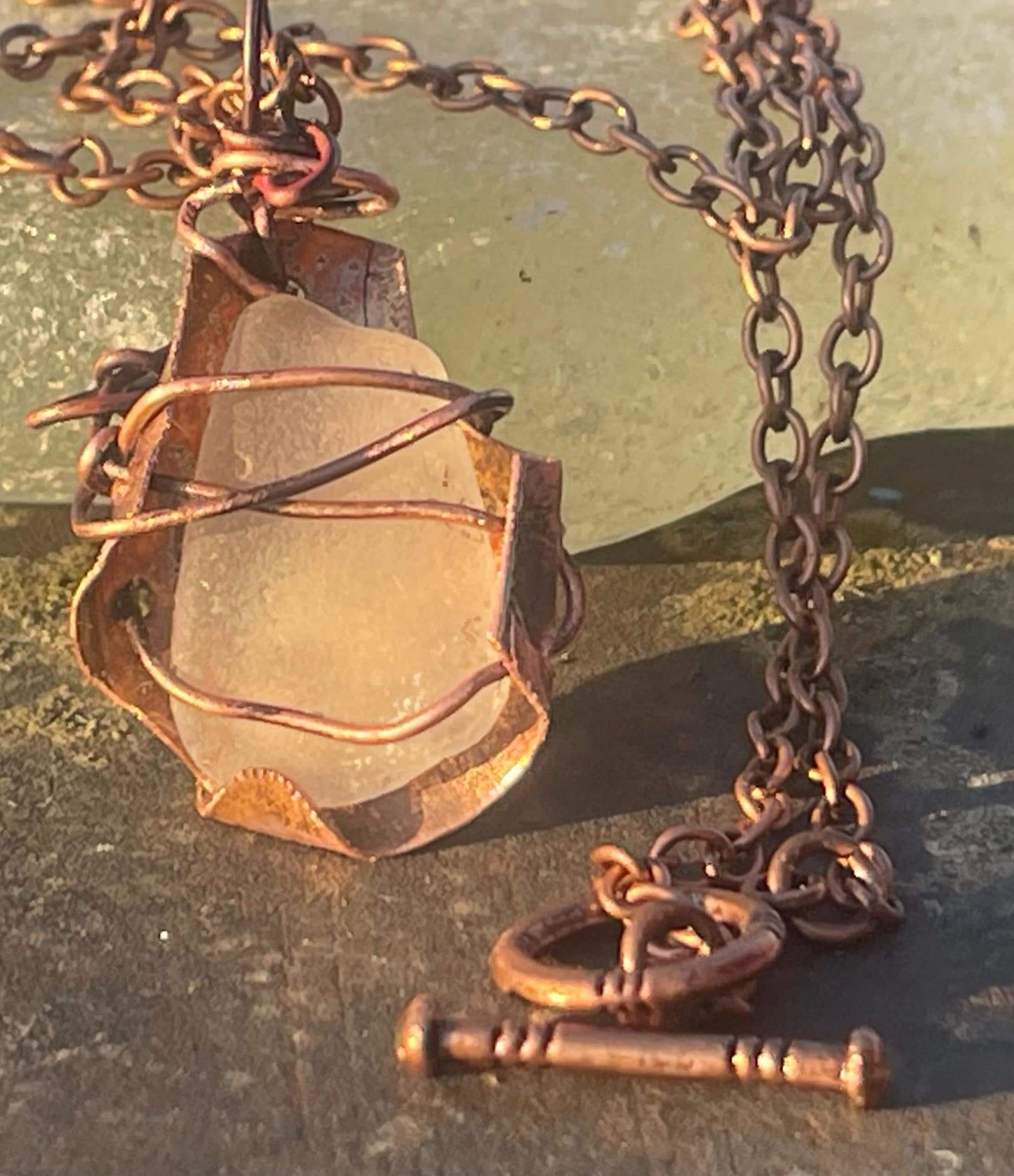 Eco friendly handmade necklace made from sea glass and naturally weathered recycled copper. Ethical jewellery. Unique handmade jewellery.
