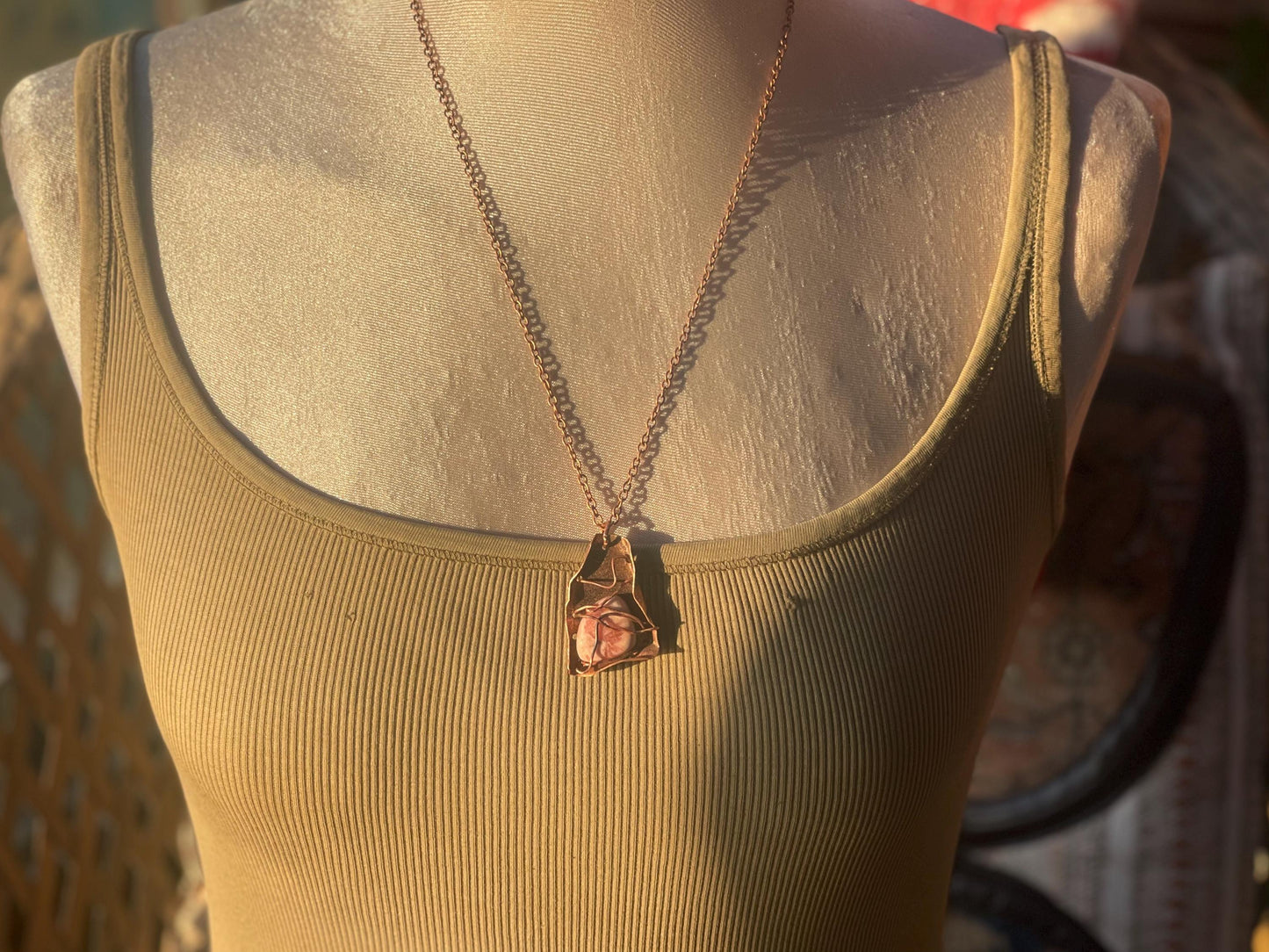 Eco friendly handmade necklace made from Rhodochrosite & naturally weathered recycled copper. Ethical jewellery. Unique handmade jewellery.