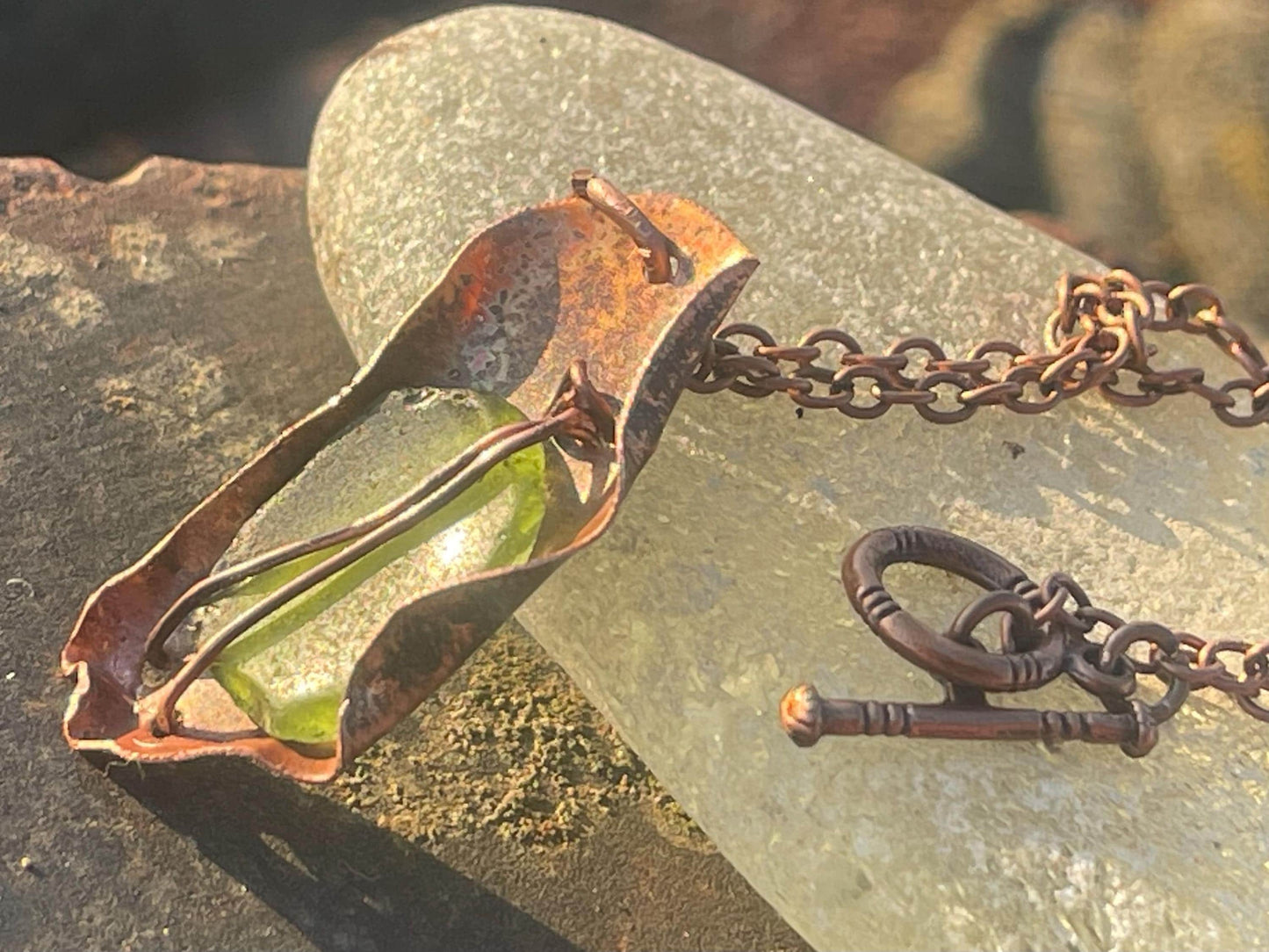 Eco friendly handmade necklace made from sea glass and naturally weathered recycled copper. Ethical jewellery. Unique handmade jewellery.